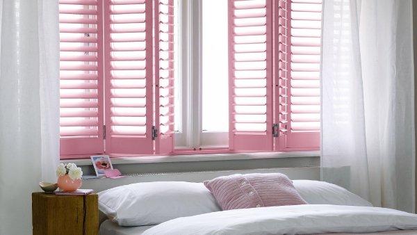 Striking colorful rose shutters to compliment accessories in daughter's bedroom.