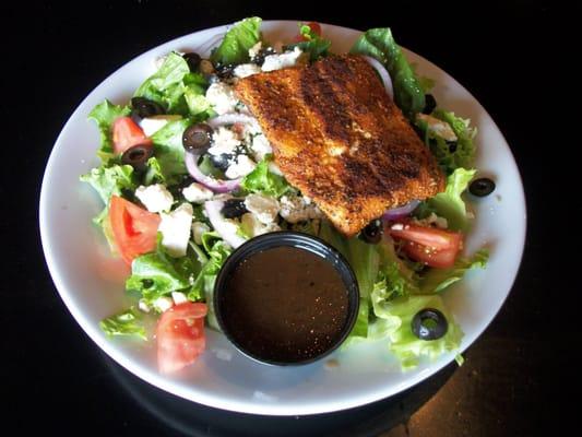 Greek Salad Special with Blackened Salmon
 Romaine lettuce, Feta cheese, tomato, onion, black olives, blackened salmon.  balsamic vinaigret