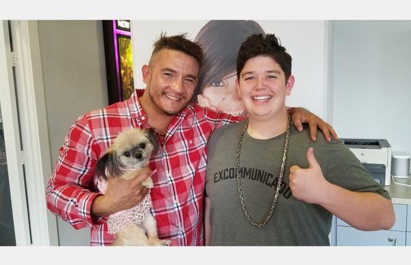 Ryan (social coordinator & all around kick ass awesome dood) holding my service puppy Bella, and Jr sans braces!