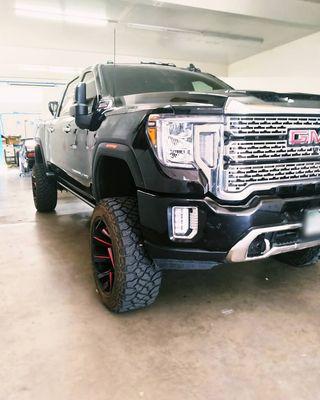 massive 2021 GMC Sierra 2500 getting its monstrous hail fixed