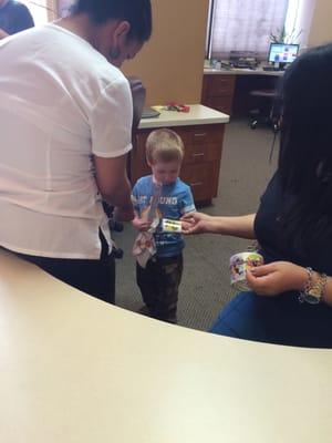 The friendly staff treating our son to prize after his exam.