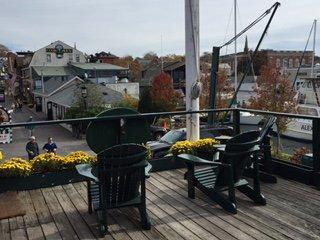 Rooms 5 & Studio 1 deck overlooking wharf and shops, facing inland.