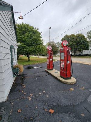 Gas pumps on the right side of building