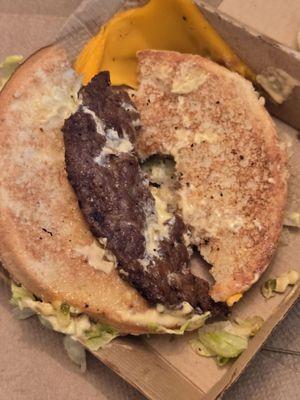 A broken in half nasty big mac worth a side of hardened plastic like cheese substance stuck like glue on the box.