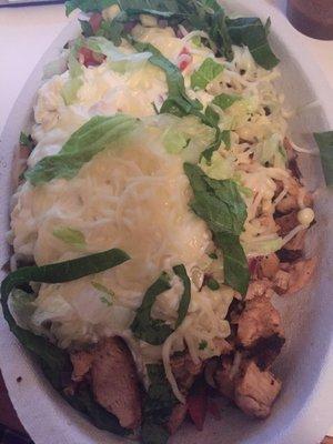 Chicken bowl with white rice, mild salsa, fajita veggies, corn, sour cream, cheese, lettuce.