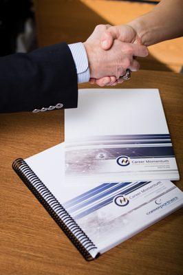 Our career transition services not only utilize a high-tech custom portal, but also a supplementary guide book.