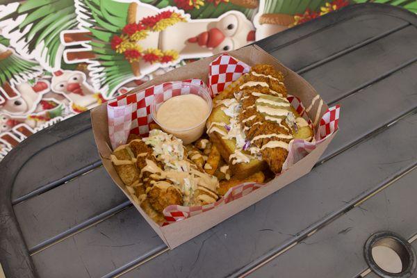 Two Hot Chicken Tenders Served In Hawaiian And Toast Bread With A Side of Homemade Coleslaw, Pickles, and Seasoned Fries.