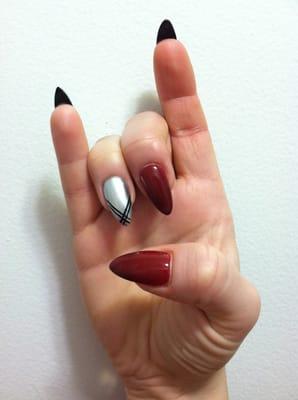 Blood Red (China Glaze) with my fun Silver (Essie) metallic ring finger nail , striped , and black under tips!