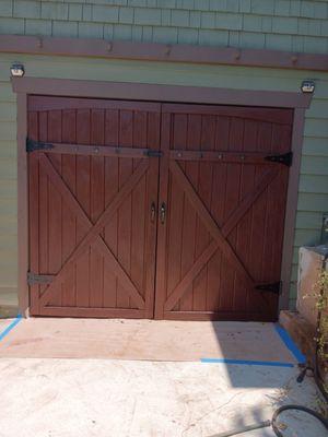 After-sanding and staining garage barn doors