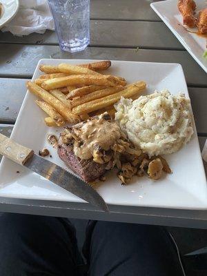 Irish whiskey steak with side of mash potatoes and fries.