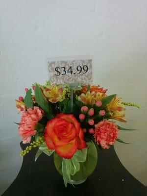 A nice sweet Fall arrangement bright and happy perfect for any occasion.