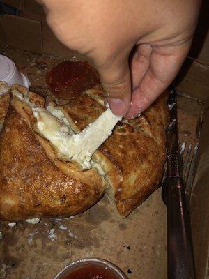 Uncooked dough on my calzone