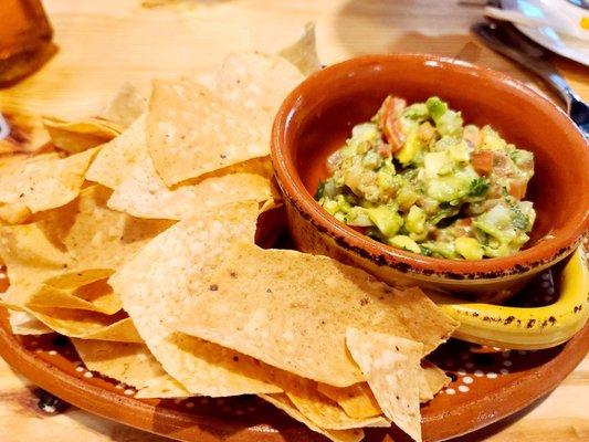 Chunky guacamole and warm chips.