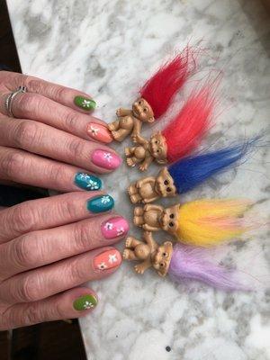 Heather loves rainbows, flowers and trolls! Nails by Heather.