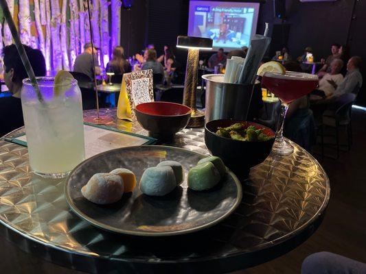 Mochi (green tea, black sesame, and mango), spicy edamame, lavender lemonade mock tail, pomegranate sour cocktail