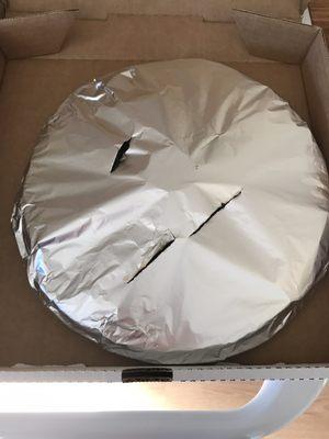 Foil wrapped pizza to keep warm