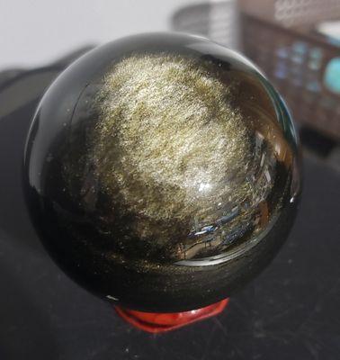 Golden obsidian sphere