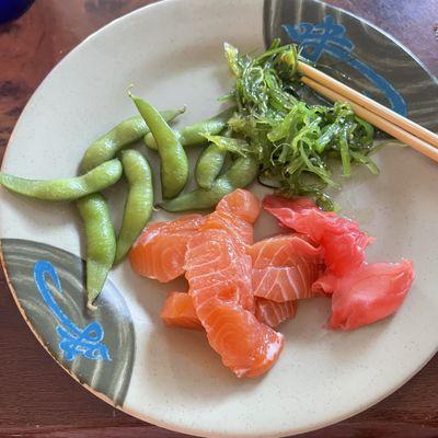 Seaweed salad, edamame, salmon sashimi, ginger. Couldn't get enough of the salmon!