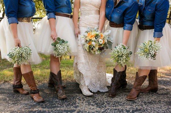 Bridesmaids bouquets of baby's breath and wheat, brides bouquet of peach roses, lisianthus and miniature roses.