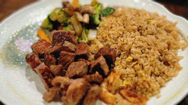 New York Strip steak, mixed vegetables and fried rice