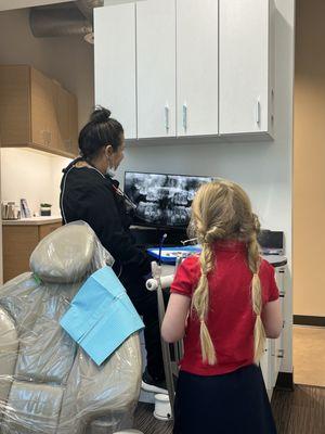 Our wonderful dental hygienist talking to my 6 year old about her X-rays! I thought this was SO cool