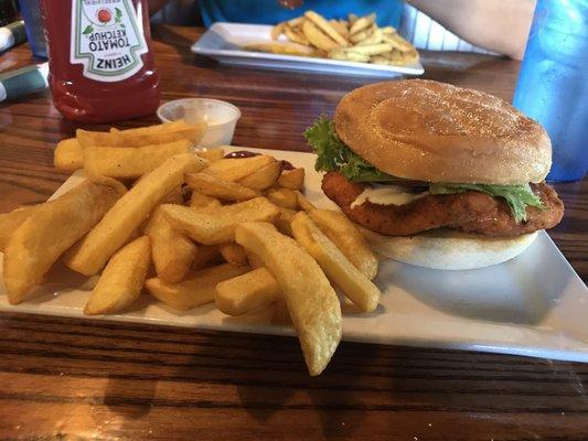 Buffalo chicken burger with blue cheese and steak fries