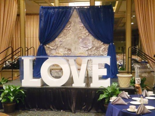 LOVE Table with White  Paper Flower Backdrop