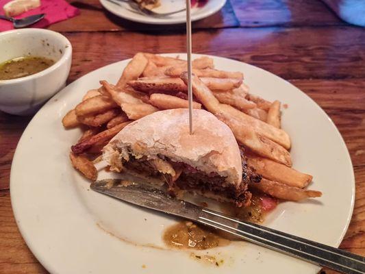 El Jefe burger: chorizo patty, pepper jack cheese, pickled red onions and green chile on a potato bun, with batter-dipped fries.