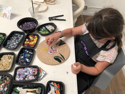 Kids love creating their own mosaics with a variety of pre-cut glass.