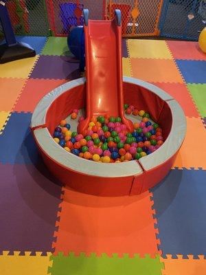 Ball pit with slide is included with rental