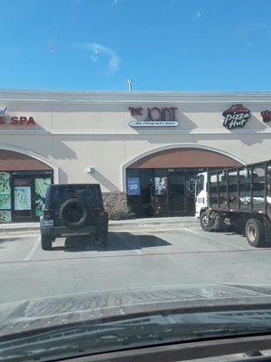 Building Exterior, including neighboring businesses.