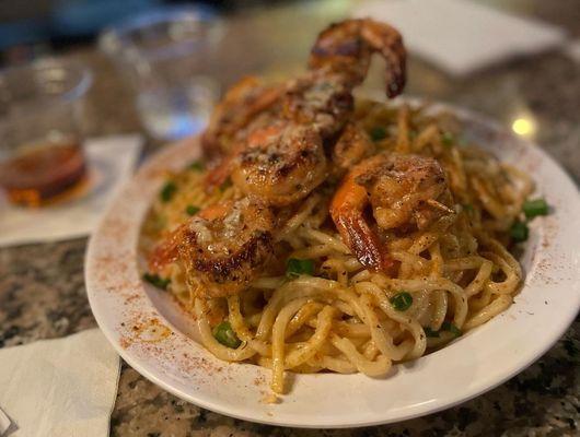 Blackened prawns, over garlic noodles.