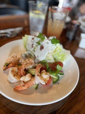 Blue cheese wedge salad with grilled shrimp.