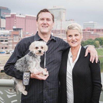 Dr.Dickerson with his wife, Julie, and their pup, Bruno.