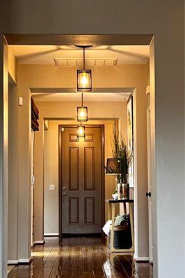 Pendant lights installed in front hallway