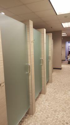 Commercial frosted heavy glass shower doors.