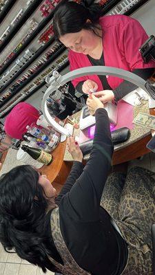 Customer getting her nails done