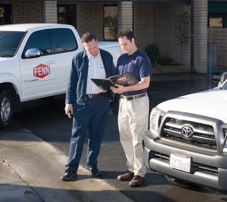 Fenn pest control technician talking to a customer