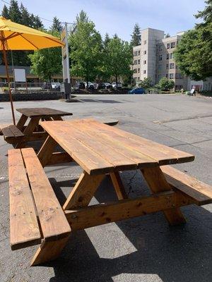 Outside bench seating and plenty of parking in the lot