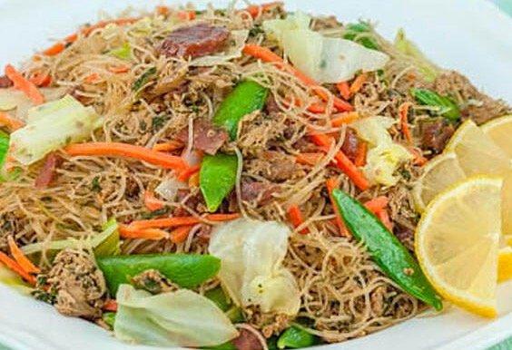 Pancit Bihon  Thin rice noodles prepared with fresh vegetables, chicken, tofu, shrimp and traditional Filipino flavor.