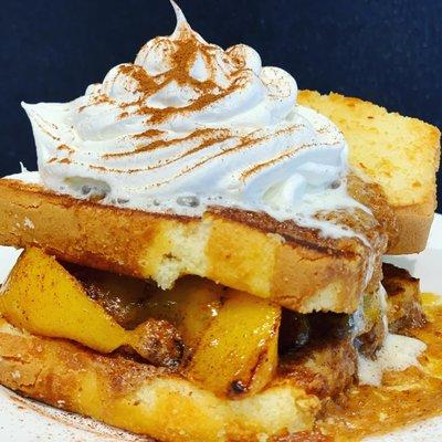 Grilled peaches on fry bread with whipped cream and cinnamon