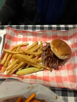 Pulled pork sandwich and fries.