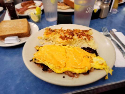 Corned beef hash, eggs and cheese  and hash browns