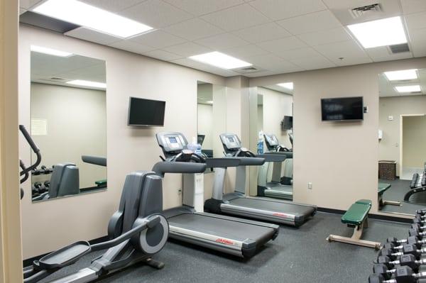 Fitness Center featuring one bike, two treadmill, and free weights.