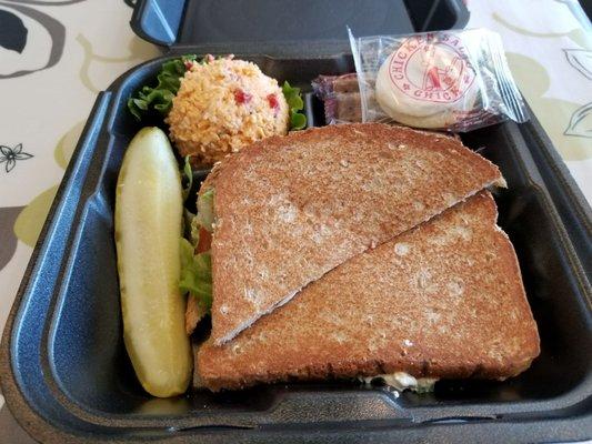 Old South chicken salad sandwich with a scoop of pimento cheese on the side.