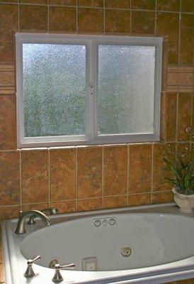 Rain glass is perfect for light and privacy in a bathroom.