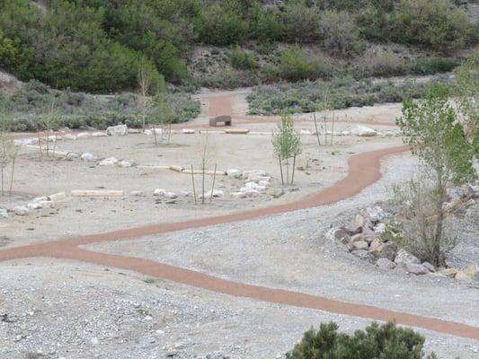 The bottom of the wash and the trailhead on the opposite side.