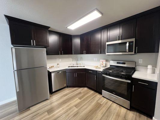 Modern kitchen with abundant counter space and upgraded appliances.