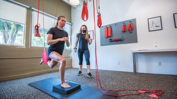 Redcord is a specialized suspension system that isolates a particular area while allowing you to move more freely without pain.