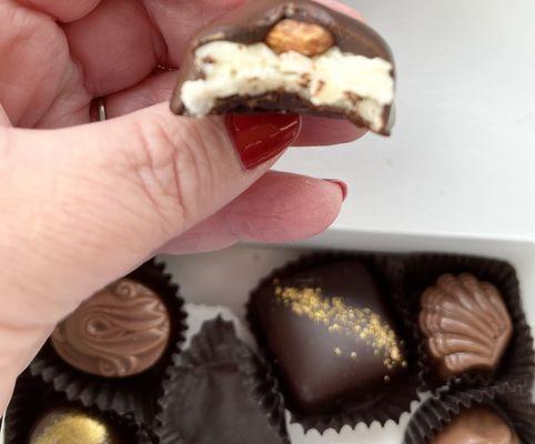 Mmmm coconut filling with an almond and covered with chocolate